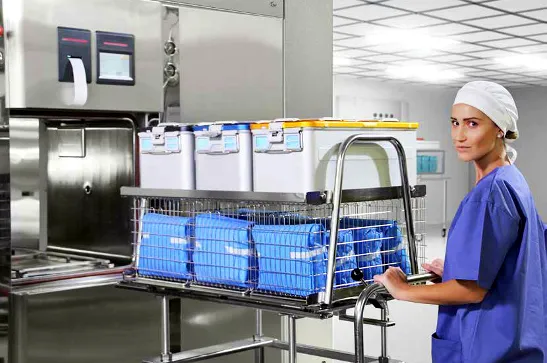 autoclave sterilizer being loaded with packed medical equipment